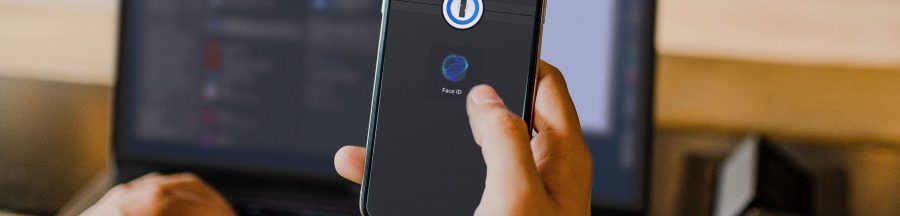 cles-identification-passkey-1password Un smartphone affichant l’outil d’authentification par reconnaissance faciale de clés d’identification